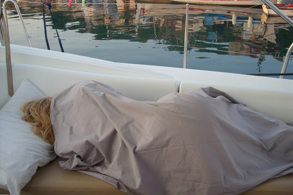 woman sleeping on sailboat