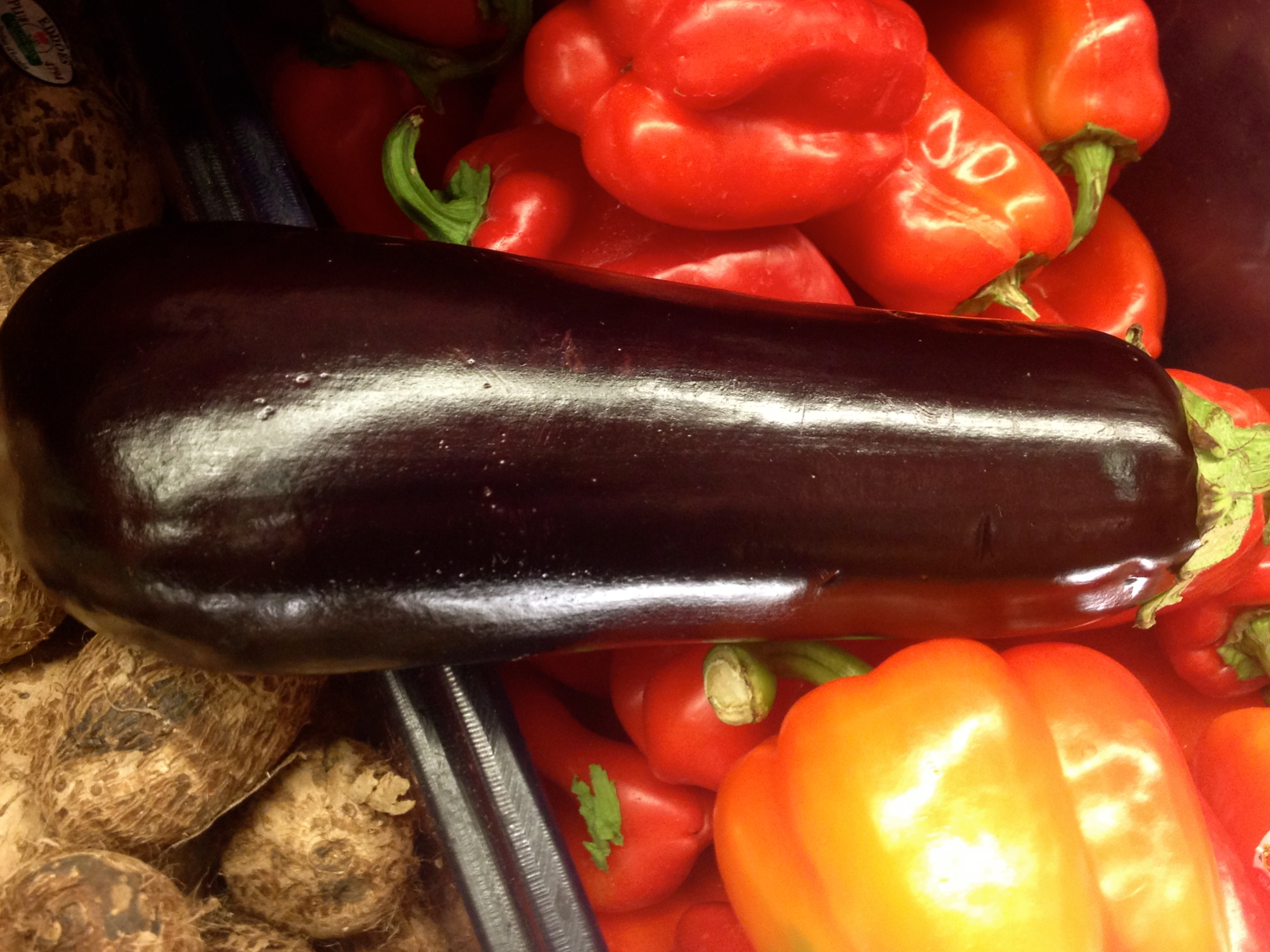 Eggplant and red and orange peppers